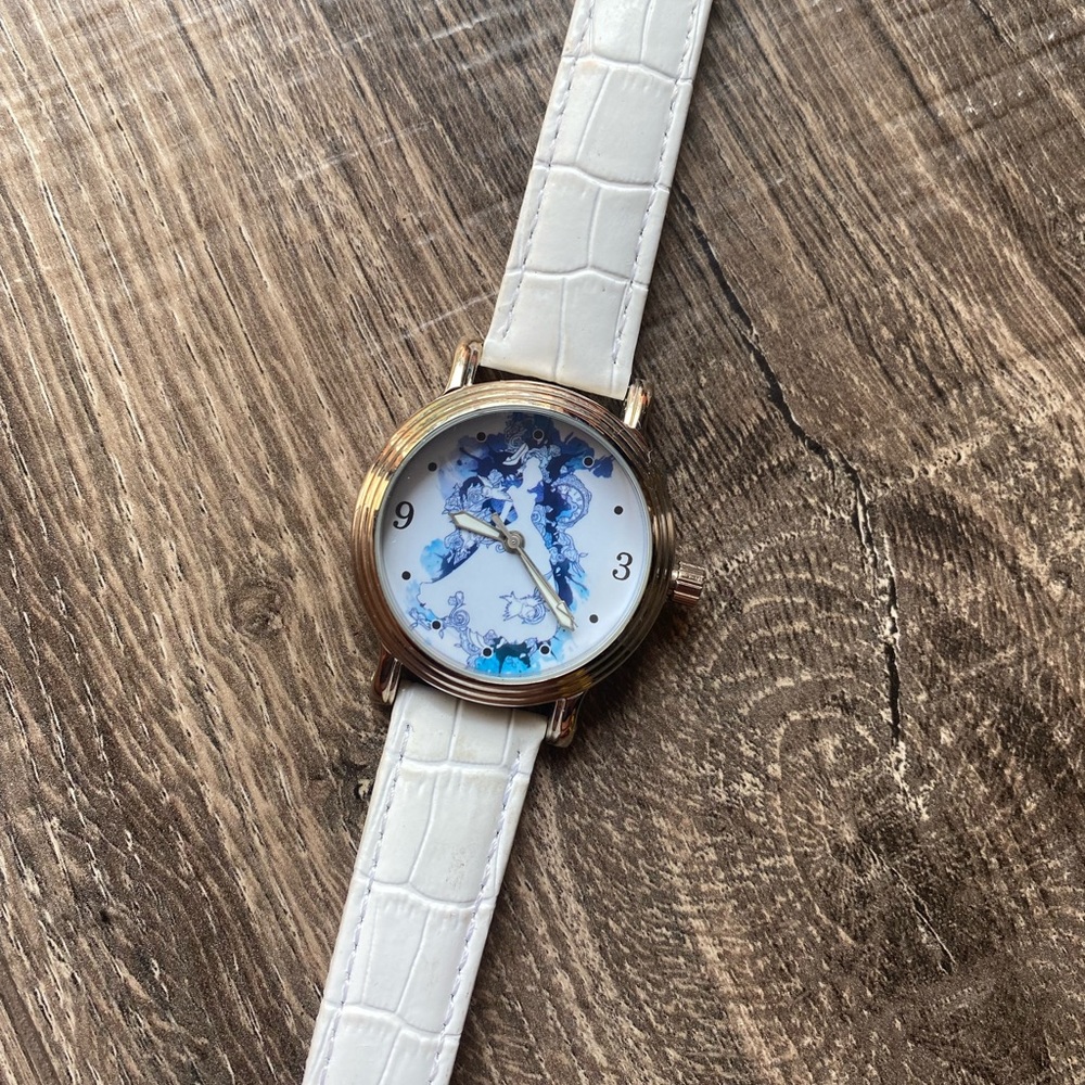 Disney Cinderella watch with white leather band. Stainless steel caseback.